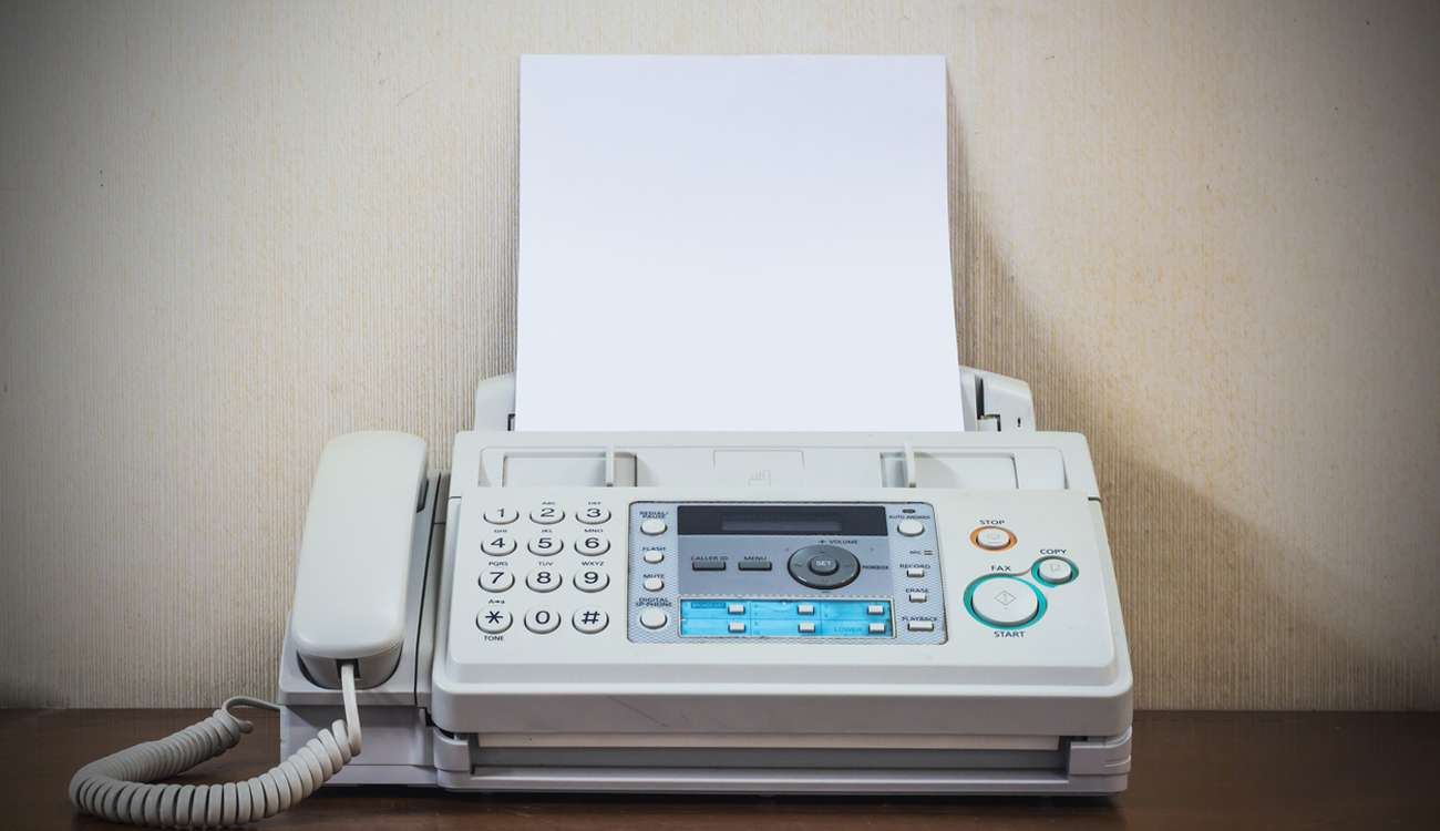 pushing start button old fax retro