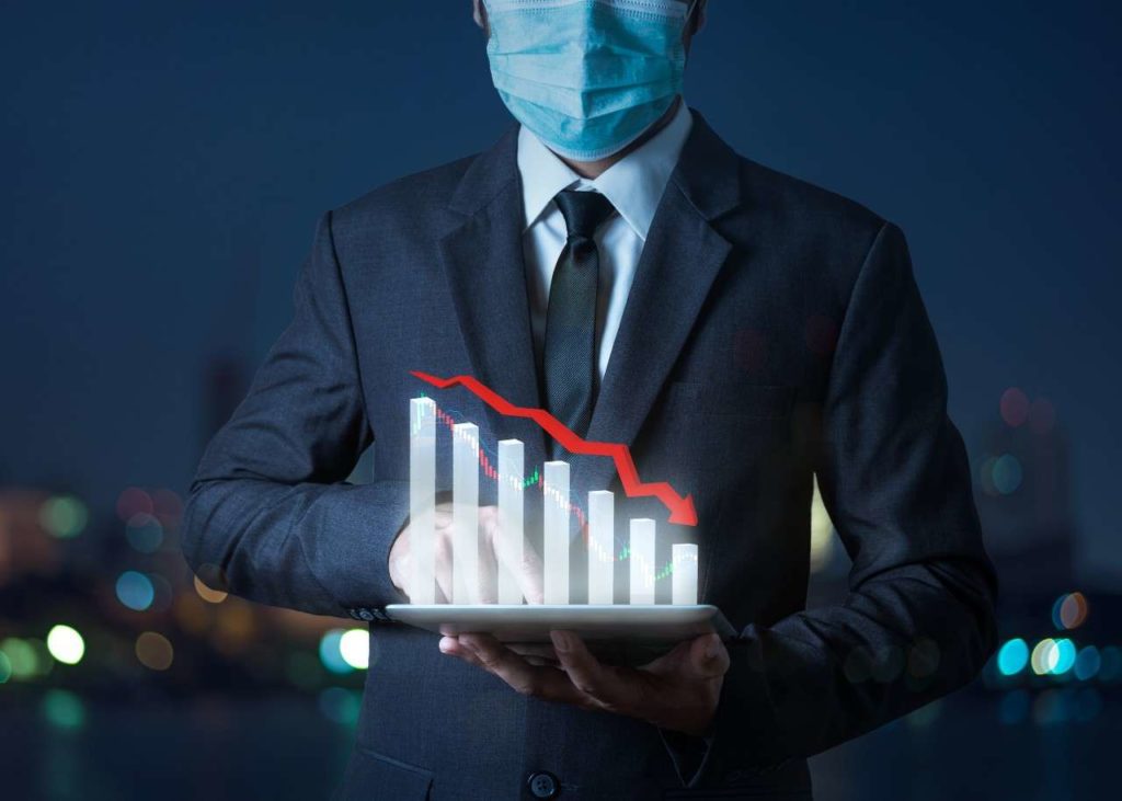 economic-crisis-arrows-fall-concept-graph-maker-stock-fall-showing-tablet-with-businessman-indicating-economic-recession-that-will-occur (1)