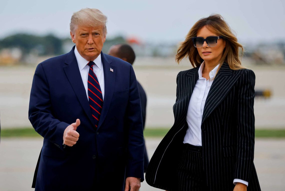FILE PHOTO – U.S. President Donald Trump walks with first lady Melania Trump at Cleveland Hopkins International Airport in Cleveland
