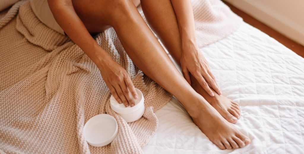 woman-using-pain-relief-cream