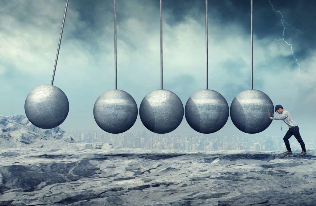 ekkremes businessman-pushing-hanging-unmoving-wrecking-ball-2