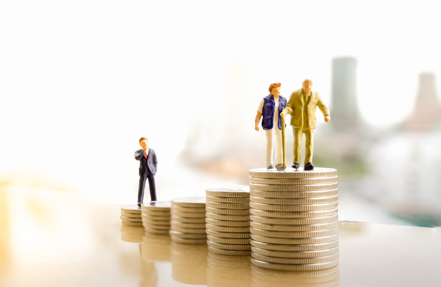 old-couple-figure-standing-top-coin-stack-with-city-backgrounds