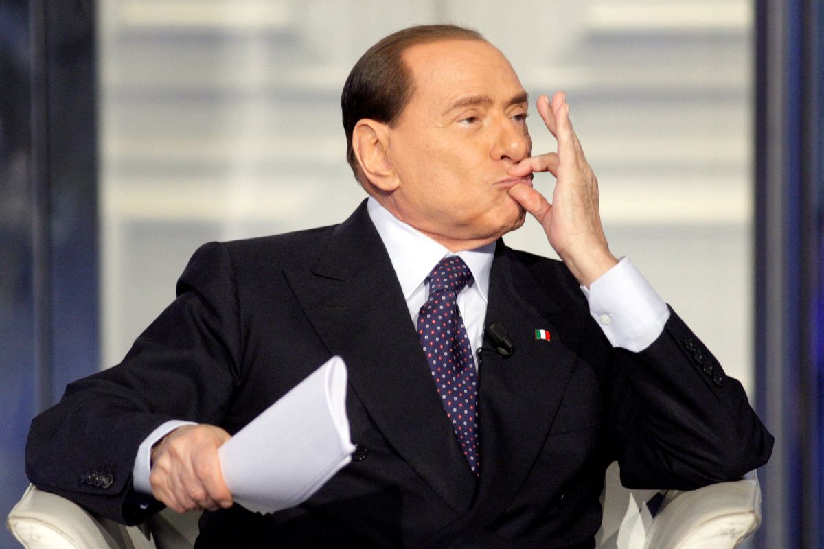 FILE PHOTO: Italy’s former Prime Minister Silvio Berlusconi gestures as he appears as a guest on the RAI television show Porta a Porta (Door to Door) in Rome