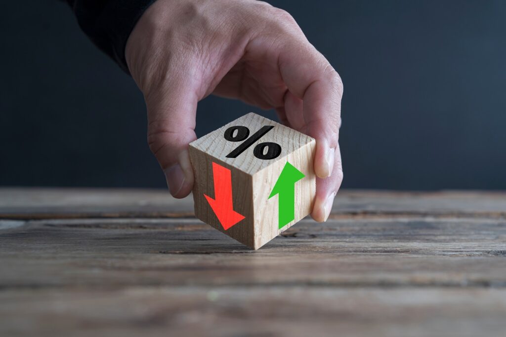 Businessman,Holds,Wooden,Blocks,With,Percent,And,Up,Or,Down