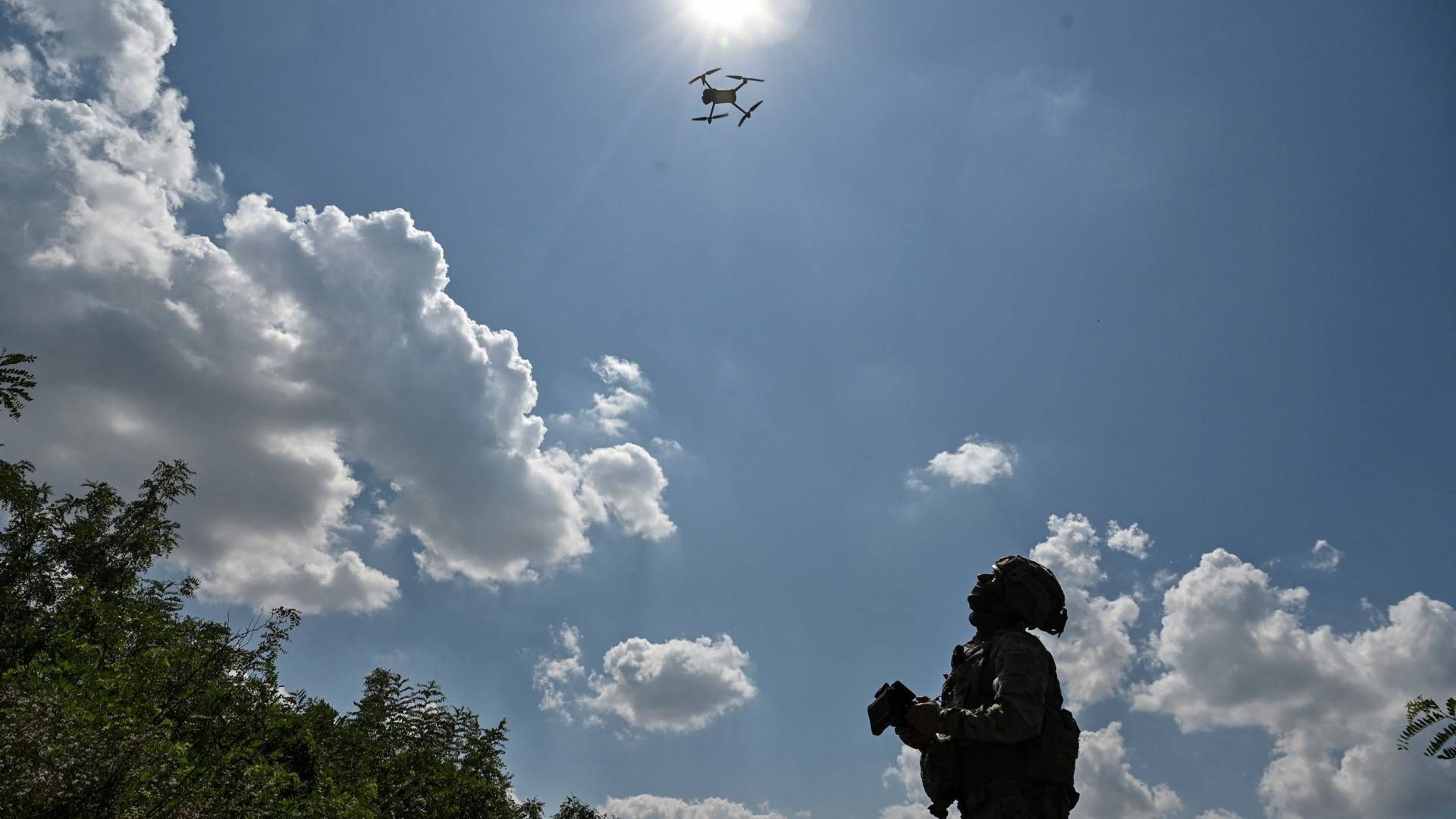 A Ukrainian serviceman launches a drone near a frontline in Zaporizhzhia region
