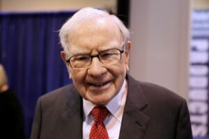 FILE PHOTO: Berkshire Hathaway Chairman Warren Buffett walks through the exhibit hall as shareholders gather to hear from the billionaire investor at Berkshire Hathaway Inc’s annual shareholder meeting in Omaha