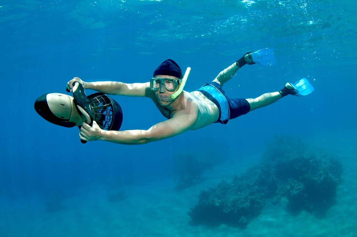 snorkeler on underwater scooter