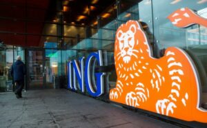 FILE PHOTO: A man walks past the logo of ING Group NV at a branch office in Amsterdam