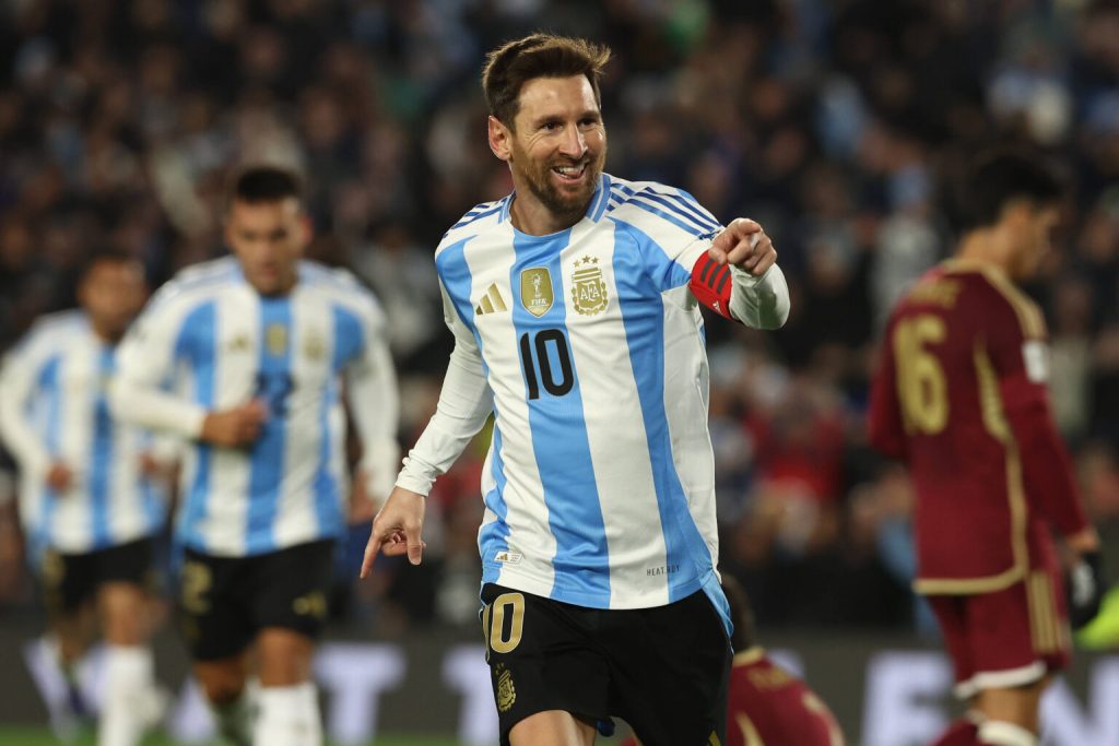 Argentina s forward Lionel Messi celebrates after scoring the team™s third goal during the South American qualification