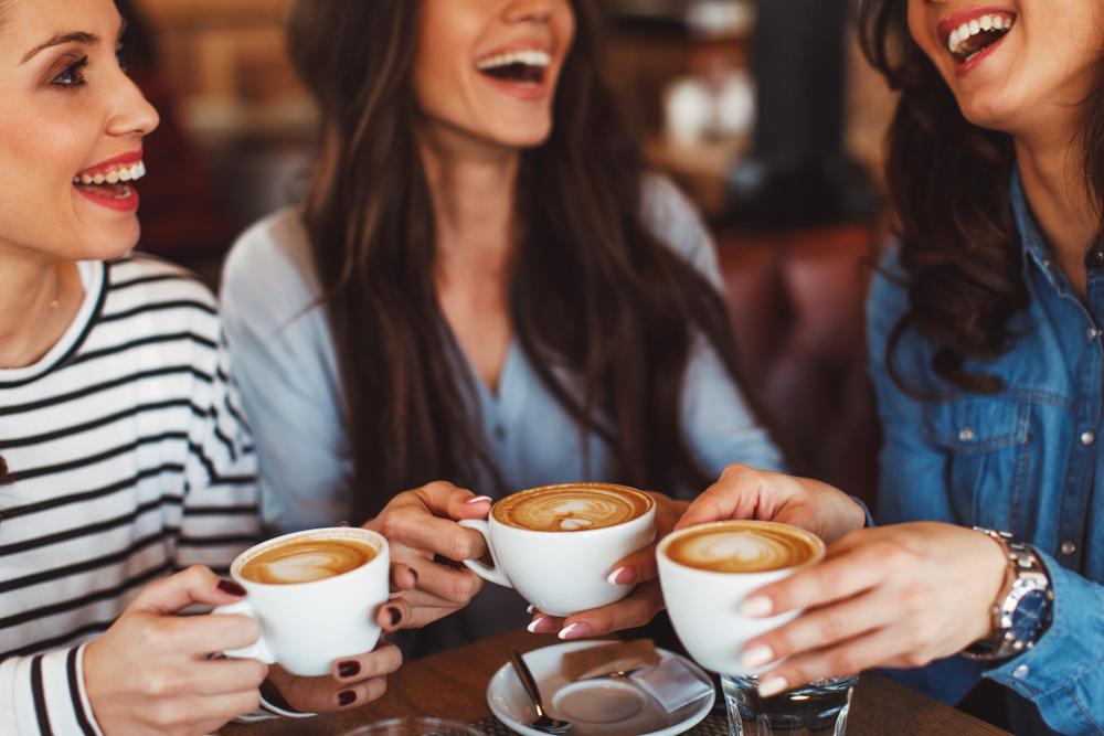 Three,Young,Women,Enjoy,Coffee,At,A,Coffee,Shop